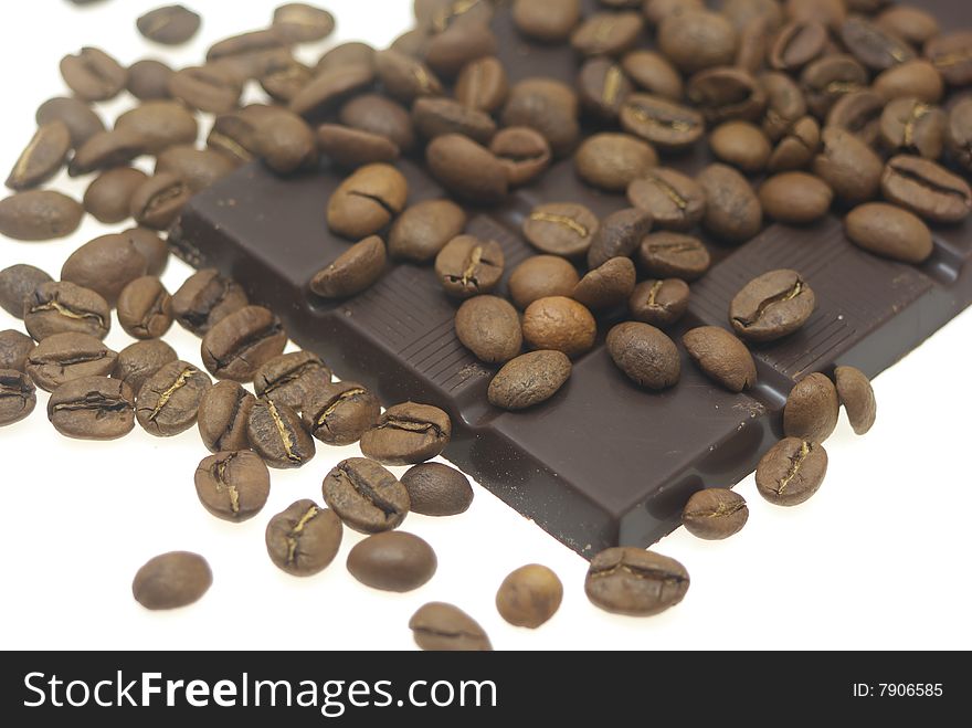 Chocolate and coffee beans isolated on a white
