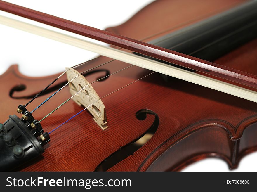 A closeup of a violin and bow. A closeup of a violin and bow