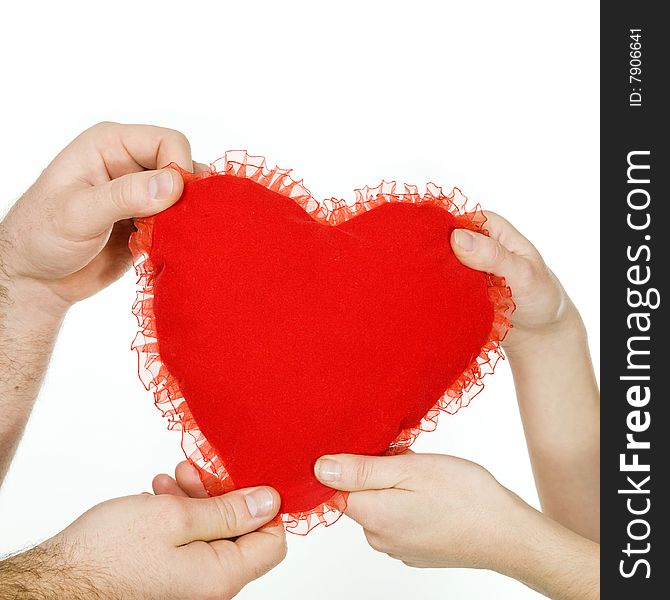 Stock photo: an image of a big red heart in the hands of a woman and a man