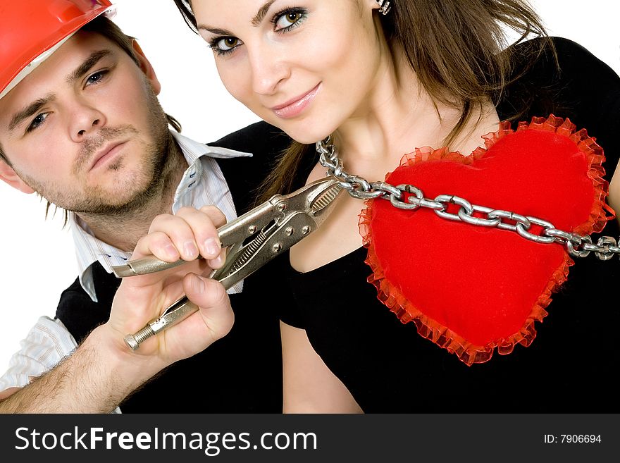 Stock photo: an image of a man with pliers in his hands and a woman with heart. Stock photo: an image of a man with pliers in his hands and a woman with heart