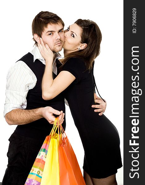 Stock photo: an image of a man with bags in his hands and a woman. Stock photo: an image of a man with bags in his hands and a woman