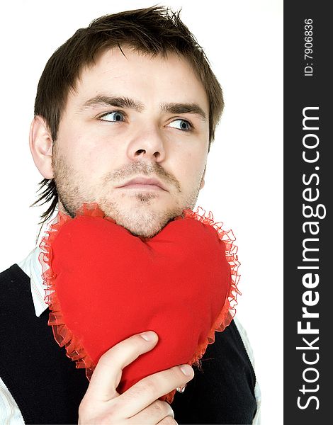 Stock photo: an image of a man with his chin on a red heart. Stock photo: an image of a man with his chin on a red heart