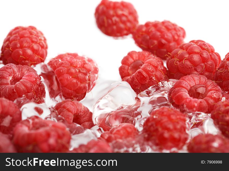 Fresh raspberries in water isoalted on white