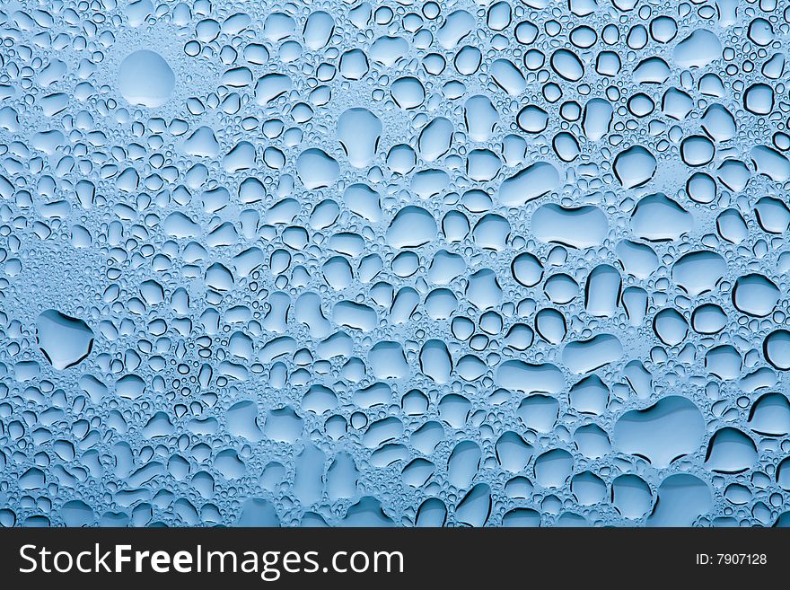 Macro of blue water drops background