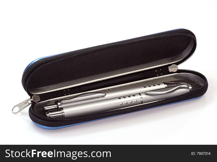 Silver ballpen and rollerball pen in a blue pencil case over white background. Silver ballpen and rollerball pen in a blue pencil case over white background