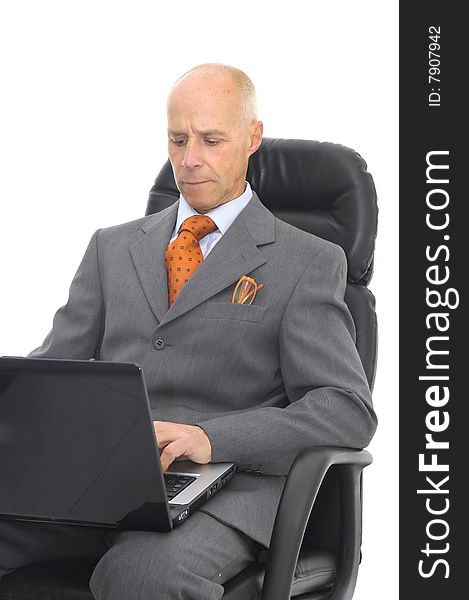 Mature man with laptop isolated in white. Mature man with laptop isolated in white