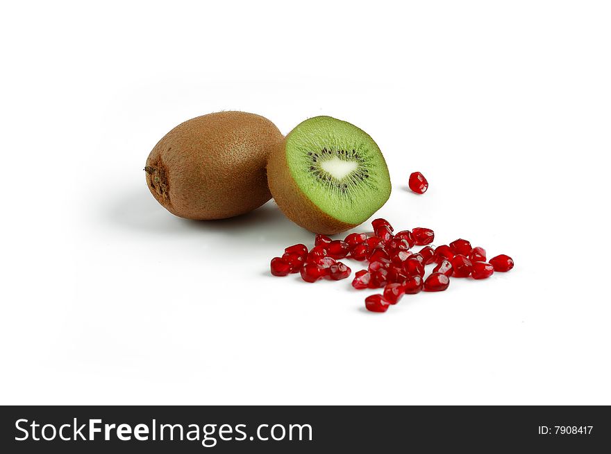 Kiwi with pomegranate grain isolated on white