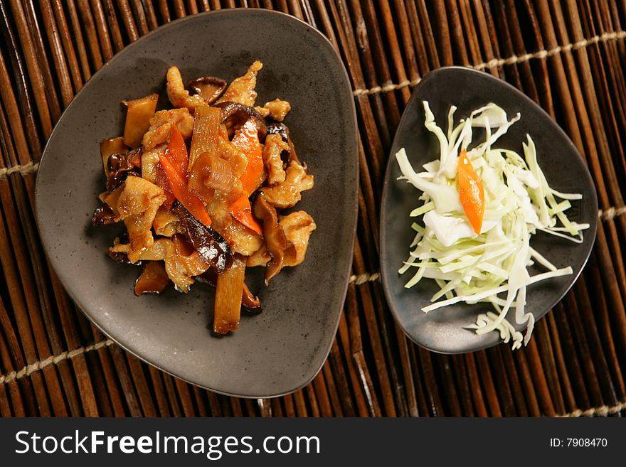 Asian mushrooms in sauce on plate