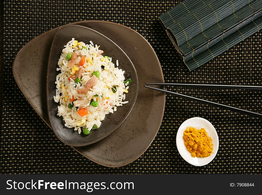 Nasi Goreng With Pork Stripes And Chopsticks