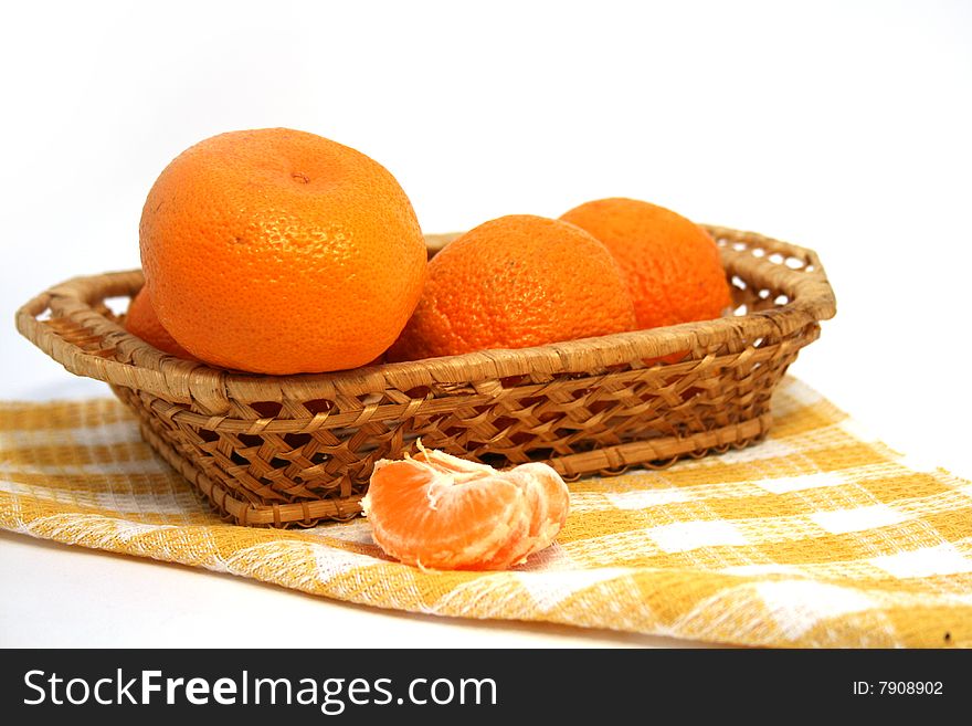 Mandarins in a basket  isolated on a white background