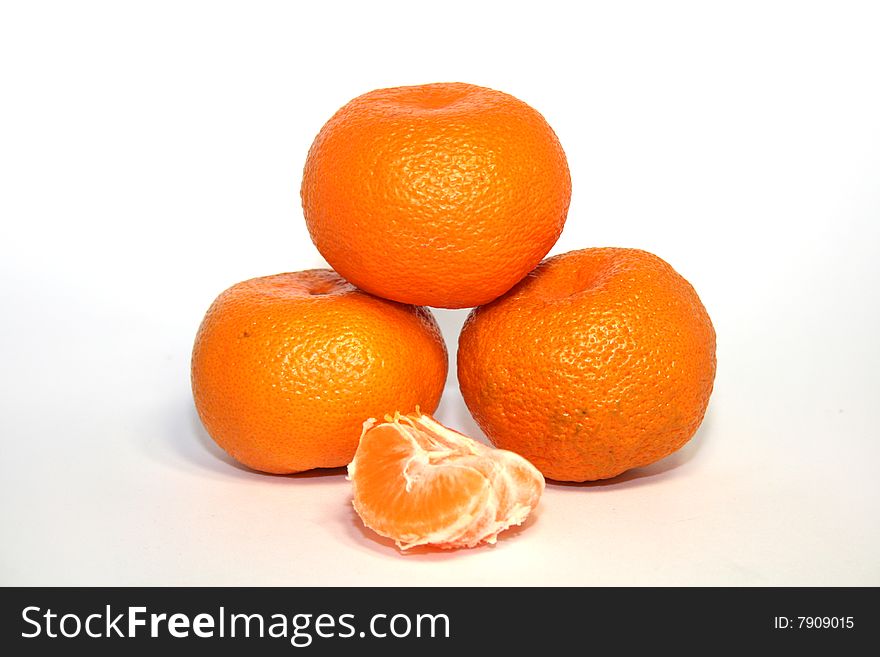 Bright and tasty orange tangerines pyramid isolated on white. Bright and tasty orange tangerines pyramid isolated on white