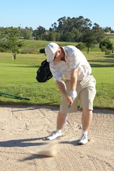 Golfer In The Sand Bunker Royalty Free Stock Image