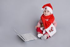 Baby Santa Claus With White Laptop Royalty Free Stock Images Baby Santa Claus With White Laptop Royalty Free Stock Images