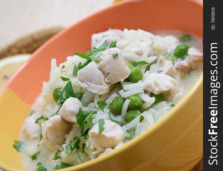 A fresh lemon soup with peas and chicken meat