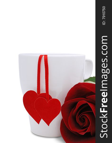 White cup with two red hearts and flower