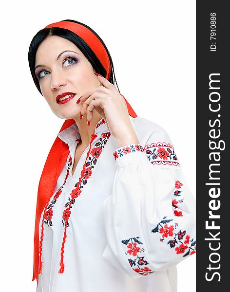 Beauty woman looks darkly, she is in traditional ukrainian clothes. Beauty woman looks darkly, she is in traditional ukrainian clothes