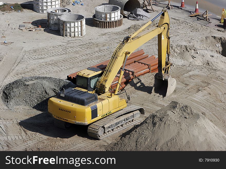 Big yellow bulldozer digging at working place. Big yellow bulldozer digging at working place