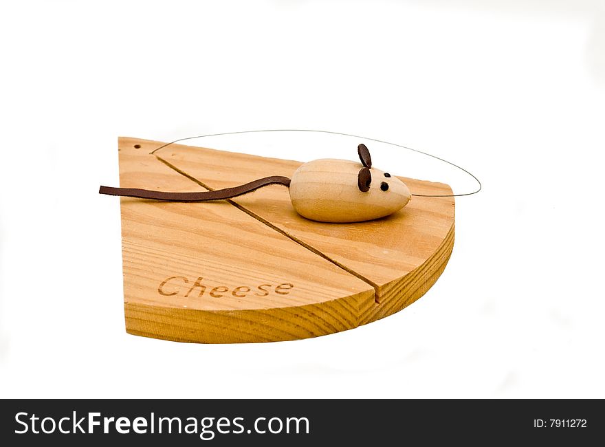 A cheese cutting board with a wire and mouse. A cheese cutting board with a wire and mouse
