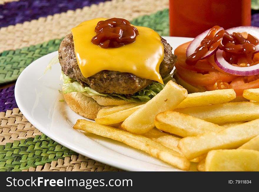 Cheeseburger with ketchup and french fries. Cheeseburger with ketchup and french fries