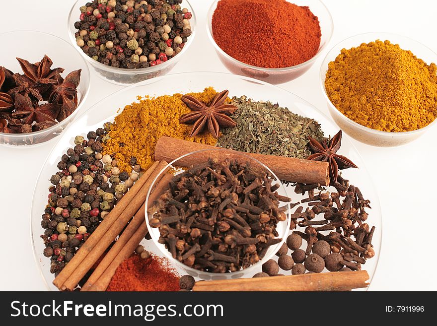 Spices in small glass bowl isolated ion white. Spices in small glass bowl isolated ion white