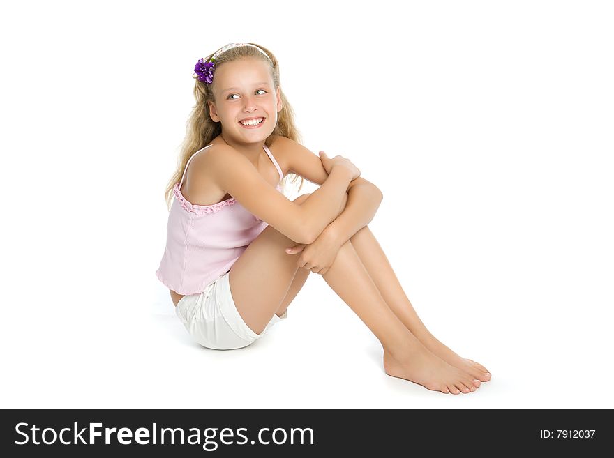 Pretty teenage girl sit on floor isolated on white