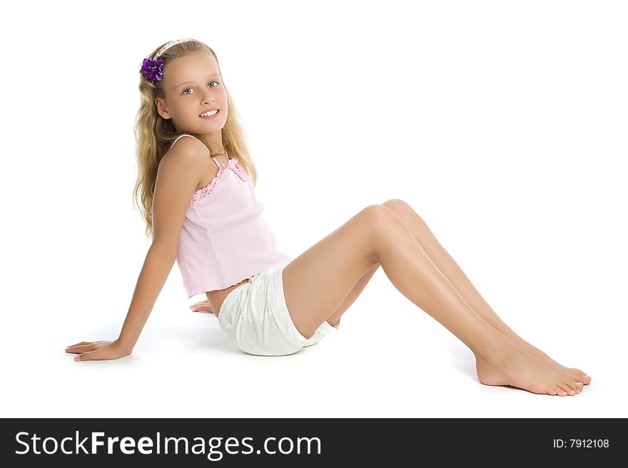 Pretty teenage girl sit on floor isolated on white