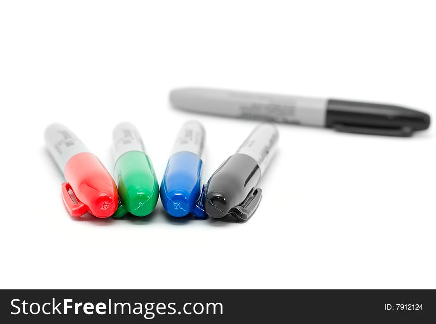 Five color markers isolated on white background