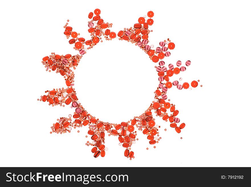 Round frame made with red and pink beads on white background