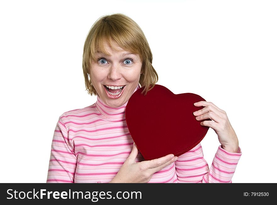 An attractive woman hugs the box of valentines day chocolates she just received as a gift.  She has an excited expression of happiness. An attractive woman hugs the box of valentines day chocolates she just received as a gift.  She has an excited expression of happiness.