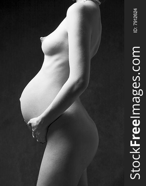 Pregnant Woman Holding Her Belly.