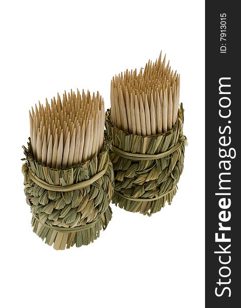 Bamboo toothpicks in a wum basket isolated on a white background