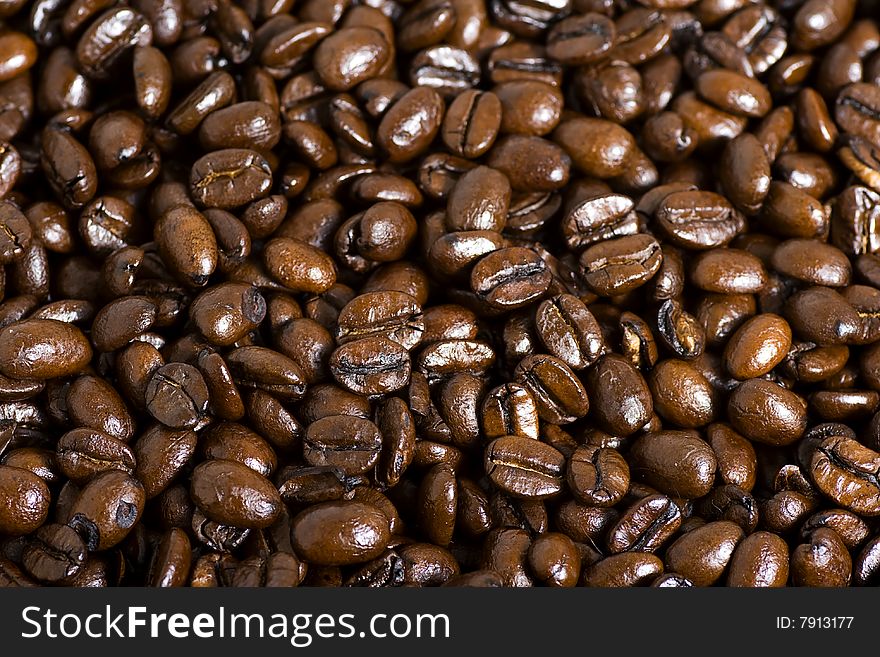 Roasted coffee bean macro background. Roasted coffee bean macro background