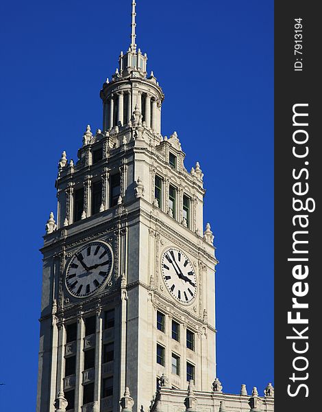 Two clocks are on the beautiful Wrigley building in downtown Chicago. Two clocks are on the beautiful Wrigley building in downtown Chicago.