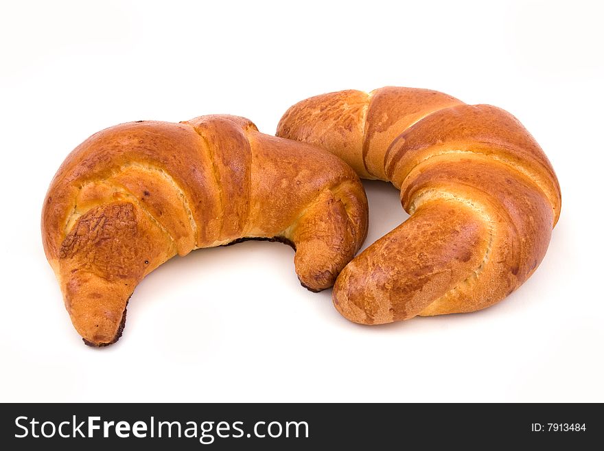 Two croissant isolated on a white. Two croissant isolated on a white