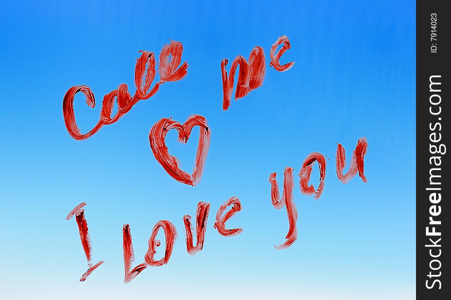 Love text on the glass against the blue sky