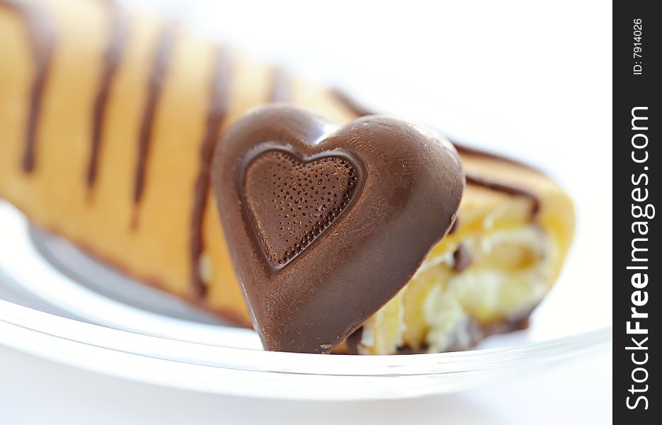 Cake and chocolate heart close up