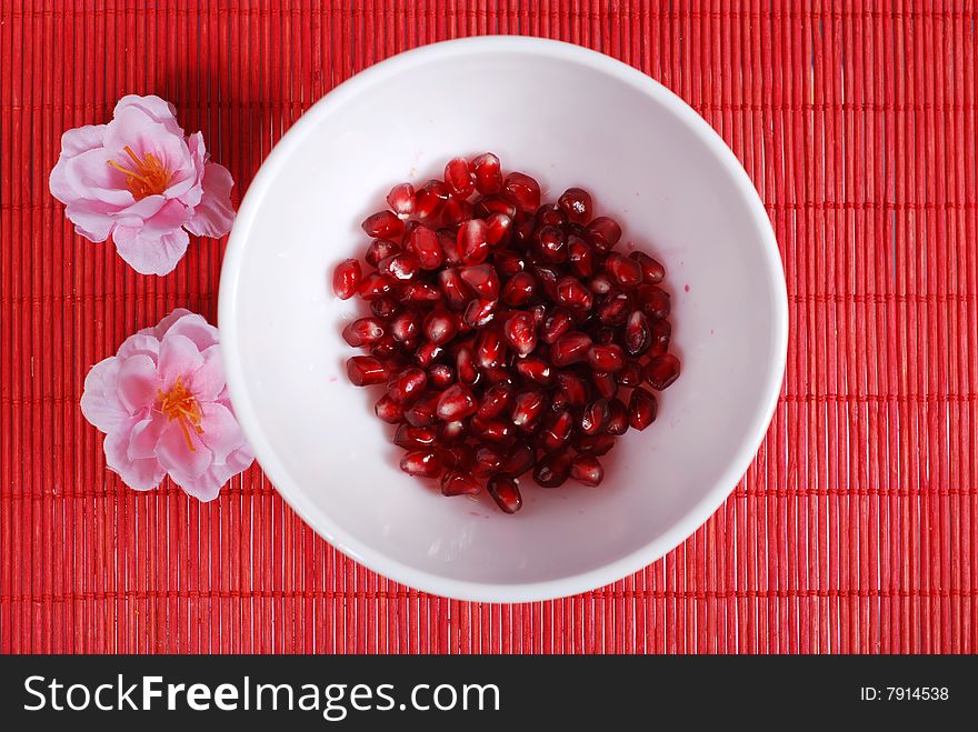 Red Seeds And White Bowl