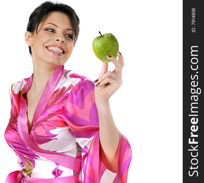 Young beautiful happy woman holding green apple on white
