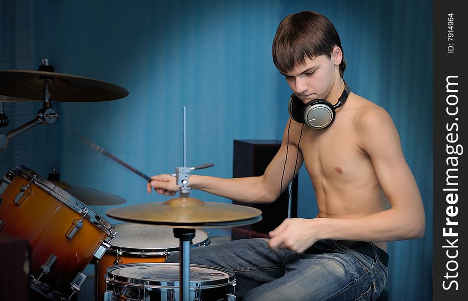 A young male drummer in action