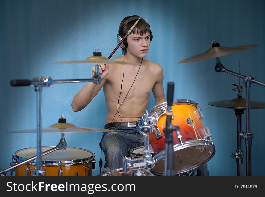 A young male drummer in action