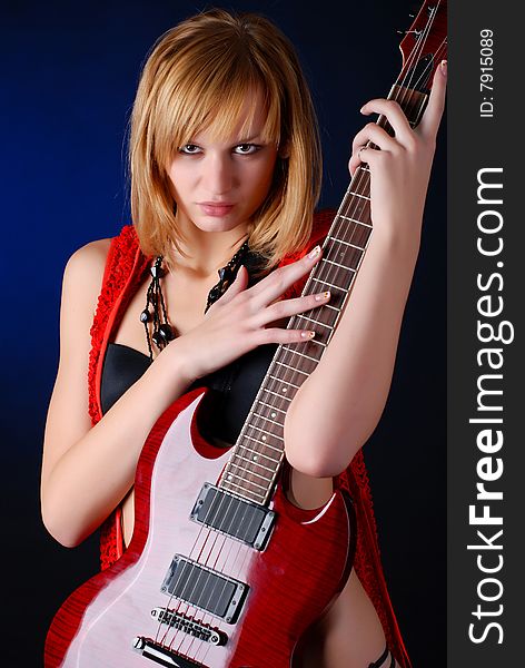 Woman with electro red guitar. Woman with electro red guitar