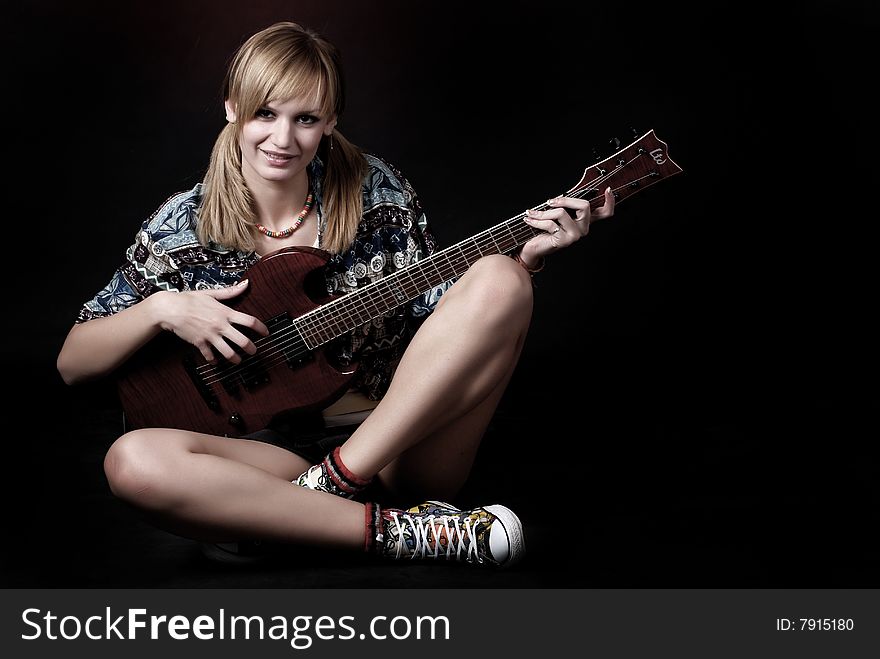 Woman with electric guitar