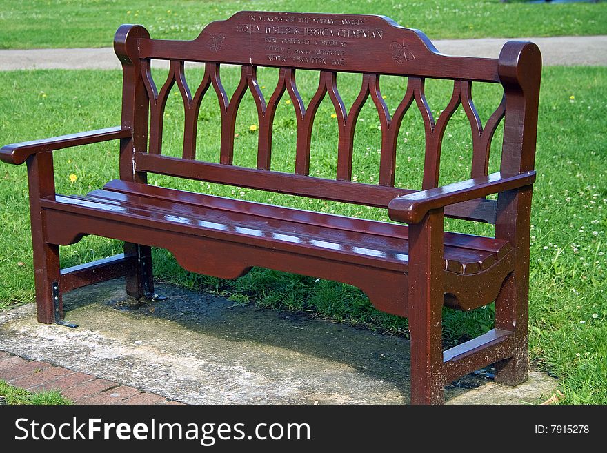 Empty bench in a public park during summer