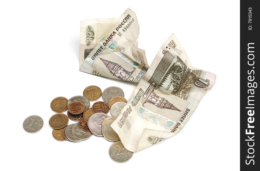 Paper money and coins are isolated on a white background