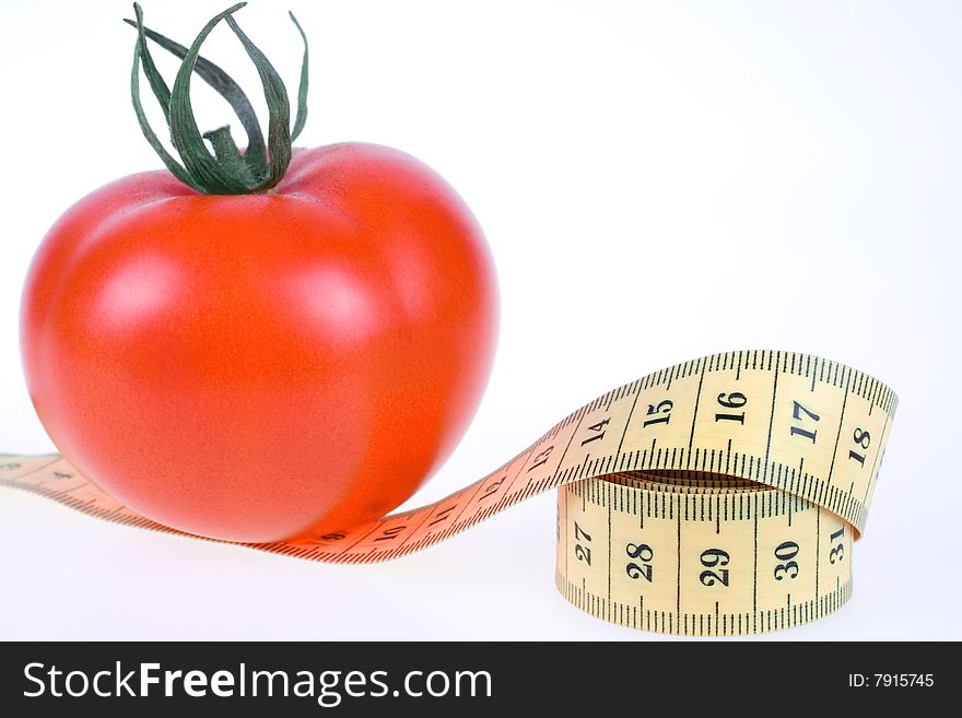 Fresh Tomato with measuring tape on white background