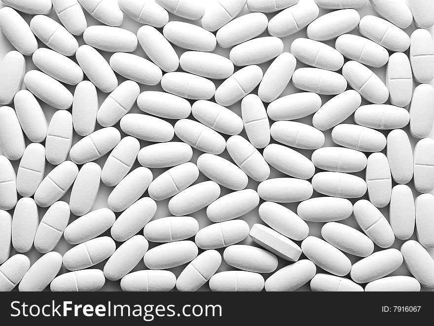 Background with many white tablets. Background with many white tablets