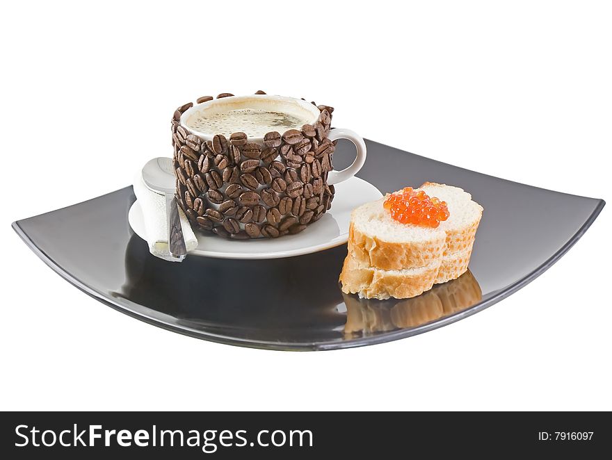 The coffee cup , original decorated by coffee grains(beans) with bread, red caviar. Isolated on white. The coffee cup , original decorated by coffee grains(beans) with bread, red caviar. Isolated on white.