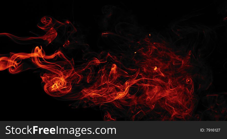 Red smoke isolated on black background