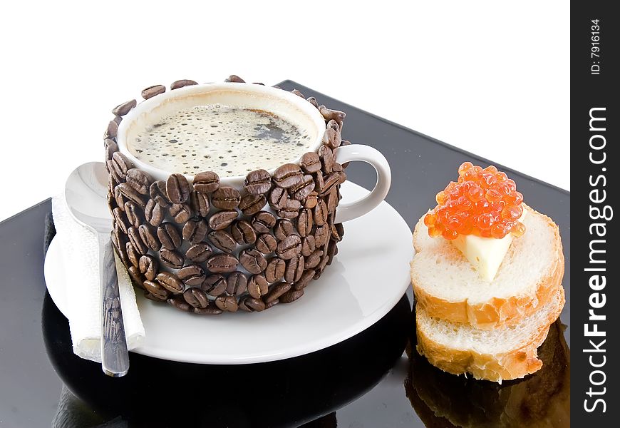 Coffee cup with bread,butter  and red caviar.