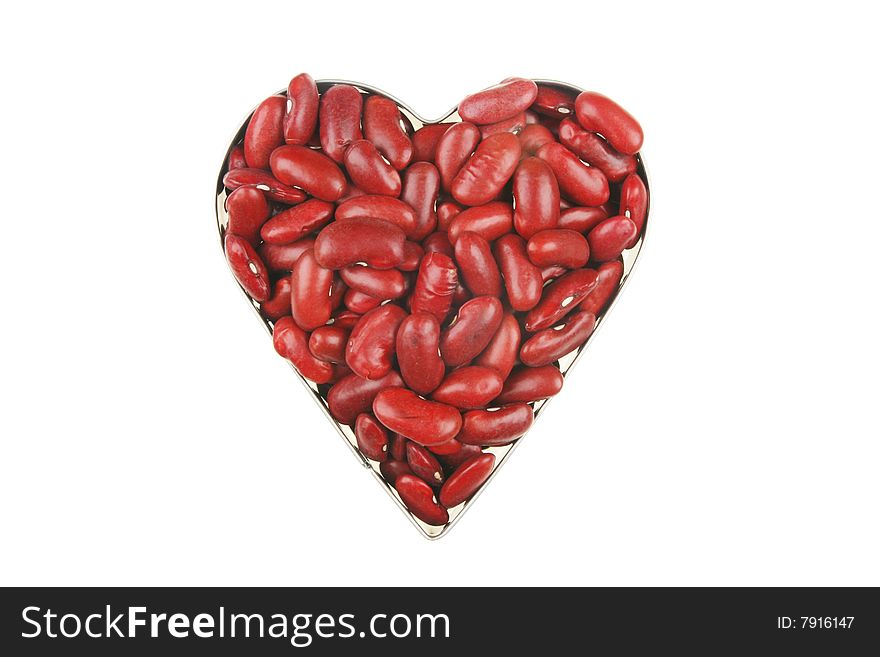 Dried red kidney beans in a heart shaped frame. Dried red kidney beans in a heart shaped frame